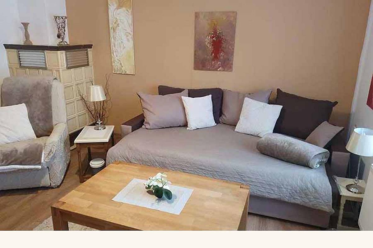 Ferienwohnungen Rita - ferienwohnungen-rita-wohnzimmer-kachelofen
